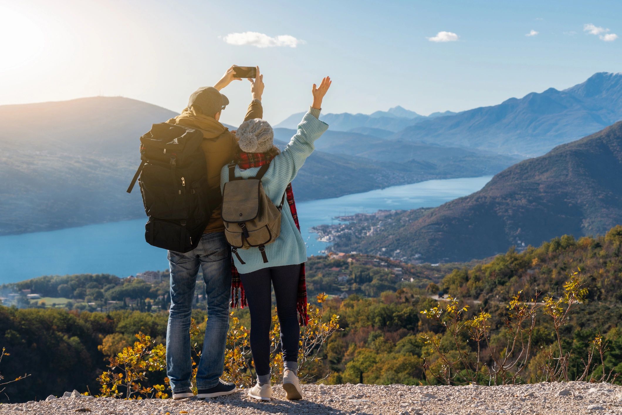 A couple of travelers with a smart phone