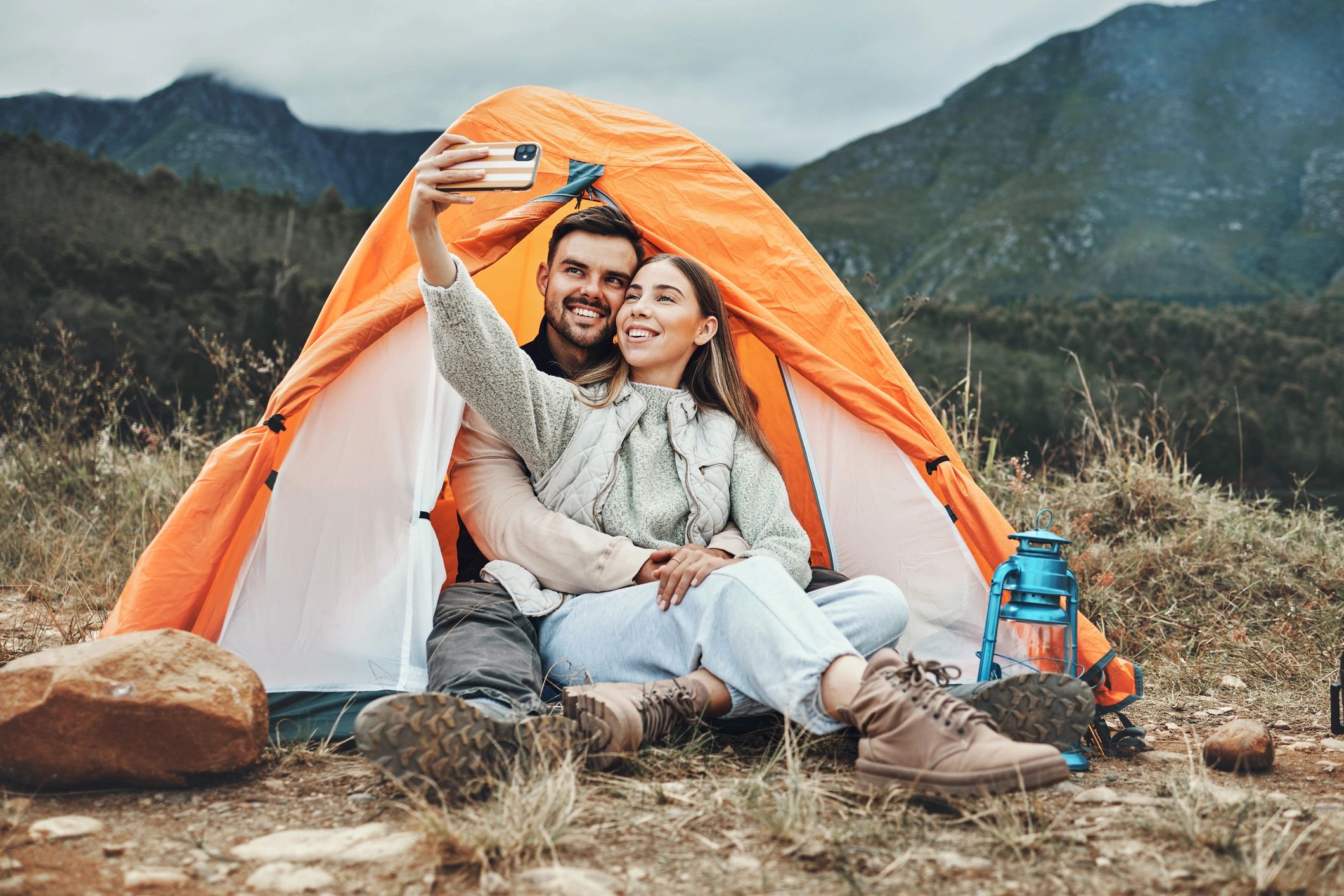 Couple, tent and happy in camping selfie, memory